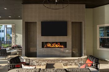 Drift town center east outdoor fireplace and seating area